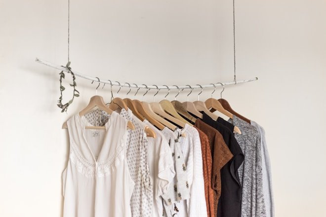 assorted clothes in wooden hangers. Fashion Deals women