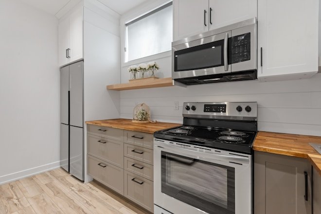 a kitchen with white cabinets